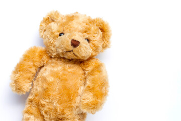 Fototapeta na wymiar Cute brown teddy bear plush toy on a white background.