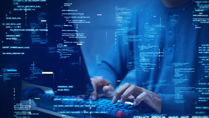 A developer types on a computer with glowing code and binary symbols overlay, symbolizing programming, software development, cybersecurity, and digital technology.