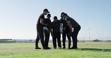 Huddling five male baseball players wearing caps on outfield preparing defense by adjusting gloves - Powered by Adobe