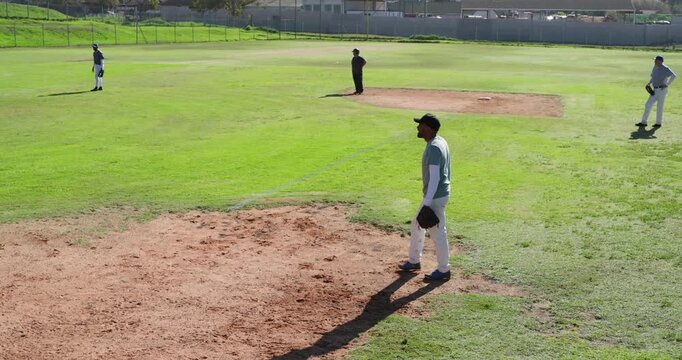 Reacting to pitch, first baseman catching ball at first base bag to record out, copy space