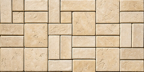 Naklejka premium Large format travertine tiles in creamy beige, rectangular shapes with filled holes and polished finish creating luxurious appearance