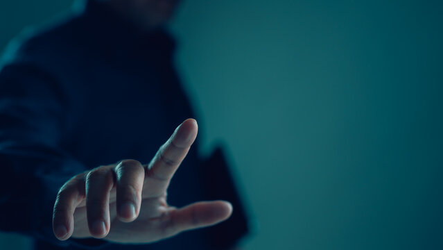 Businessman's hand touching virtual screen interface. Futuristic technology concept shows digital transformation, innovation, business connection, network security, cyberspace interaction, data