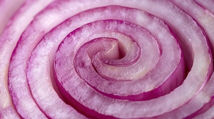 A close up of the concentric layers of a red onion slice