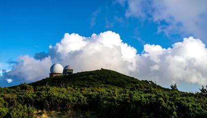 Hilltop radar domes under a vibrant sky