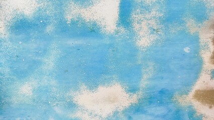 Background of an iron wall with faded blue paint because it is old and rusty. Blurred gray rusty grunge metal texture with Instagram style filter. Vintage effect.