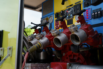 Firefighters are working together to put out the fire with water.