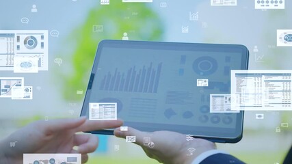 Business data concept with group of engineers using tablet in city