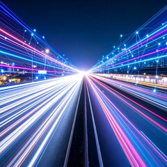 Light trails converge on a highway at night, creating a dynamic, energetic composition