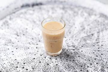 Pineapple coconut smoothie on bright background. Soft focus. Copy space.	