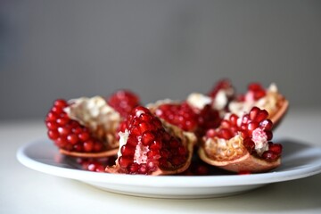 Fresh pomegranate pieces rich in antioxidants and vitamins, perfect as a nutritious snack for a healthy lifestyle, fitness diet, or post-workout recovery.