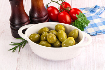 Green marinated olives in the bowl