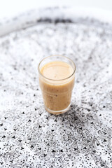 Pineapple coconut smoothie on bright background. Soft focus. Copy space.	