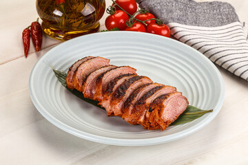 Sliced duck breast baked with cherry