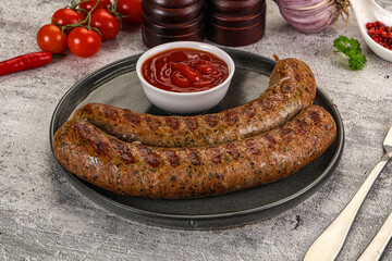 Grilled beef sausages with sauce