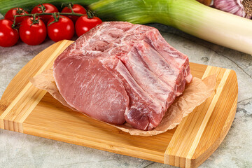 Raw pork loin cut with bone
