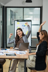 Asian business group delighted with success in their careers	