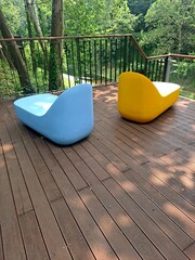 Colorful chairs by the stream in the sun shinning forest park in Seoul, South Korea