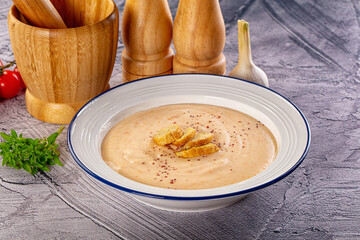 Tasty cheese cream soup with crouton