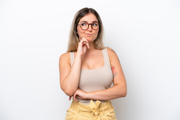 Young Rumanian woman isolated on white background having doubts and thinking