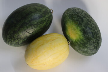 Vishala and Aarohi watermelons with yellow and green rinds, symbolizing freshness, variety, and farming