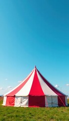 Large red and white striped tent under clear blue sky, festival, clouds, canvas
