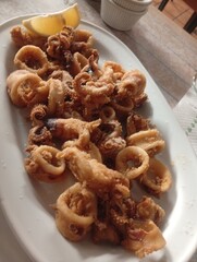Spanish tapa of small squid in batter fried with lemon 

