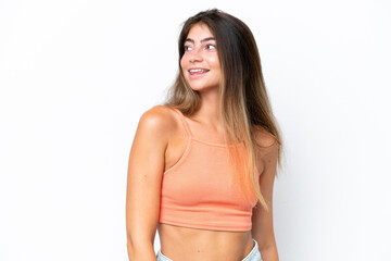 Fototapeta premium Young caucasian woman isolated on white background looking to the side and smiling