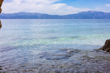 Adriatic Sea in the morning covered with azure ripples of small waves from a light breeze. Peaceful silence of the seascape. Croatia, village Padaca