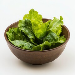 Fresh Green Lettuce In A Dark Brown Bowl On White Background