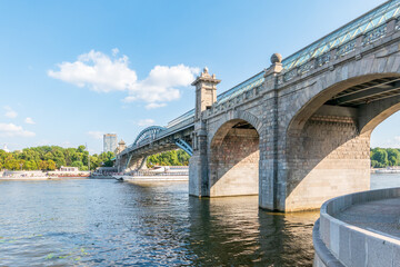 View of the Moscow river embankment, Pushkinsky bridge and cruise ships at sunset.