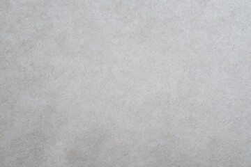 Fototapeta premium Neutral gray vertical gradient paper background with subtle texture, minimalist design for professional documents and creative projects