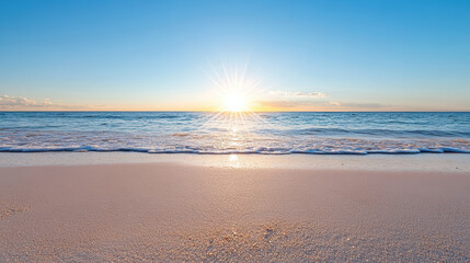 Obraz premium Sunrise over calm ocean waves creates serene beach scene with soft sand and clear sky