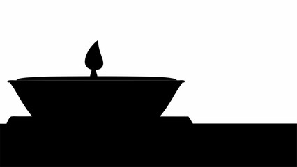 Silhouette of a diya lamp with a flame on a flat surface against a white background creates a simple image