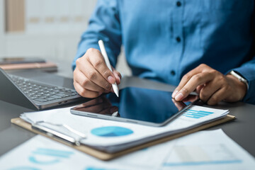 Using tablet analysis data. Analytics finance audit company. financial planning strategy. investment plan. evaluation digital marketing management. Analysis e-commerce. Accountant document consulting.