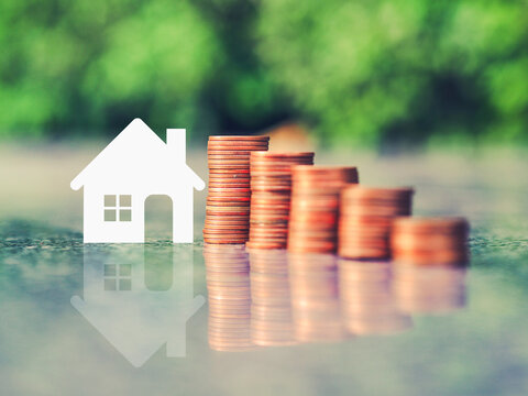 Saving money for house. Real estate or property investment concept.