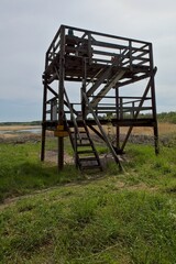 Fototapeta premium Lintulahti birdwatching tower in cloudy spring weather, Virolahti, Finland.