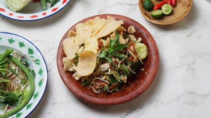Close up lotek Karedok, Sundanese Signature Dish, Steamed or Raw Vegetable with Spicy Peanut Sauce.