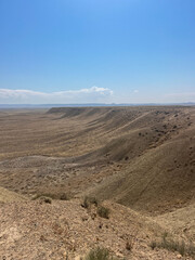 Scenic desert viewpoint near Moab, Utah with rolling hills and clear blue sky