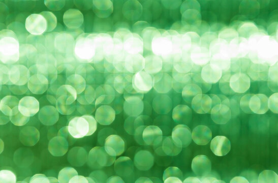 Abstract blurred green light bokeh background, festive season concept background, green bokeh pattern background