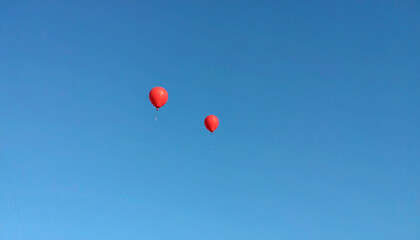 Fototapeta premium Red Balloon Floating with Sky Negative Space