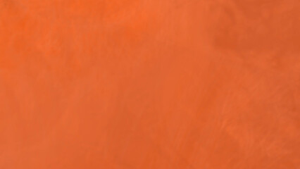 Warm orange background with subtle texture provides a vibrant and energizing backdrop for your creative work