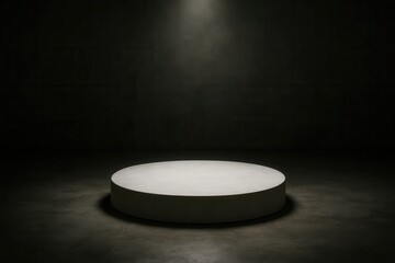 An empty stage awaits its performer in a dimly lit room, where light filters through the shadows