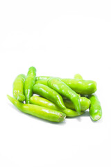 Fresh large green chillies cultivated by farmers for sale and self-eating - for seasoning and appetizing food on a white background with local hot letters.