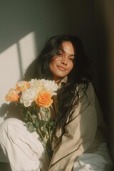 A woman with beautiful flowers radiates happiness in a cozy lightfilled space showcasing natural beauty