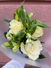 Bouquet of fresh white roses and white alstroemerias 
