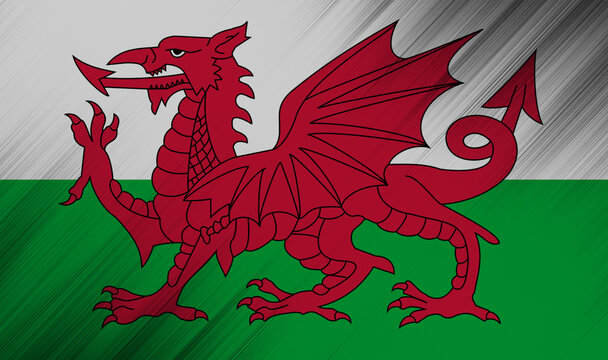 Welsh dragon flag waving proudly in vibrant colors at sunset