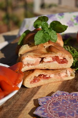 Closeup Savory Calzone with Fresh Basil Macro photography