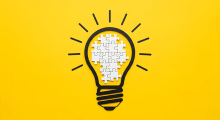 Brilliant idea concept with puzzle pieces forming lightbulb on vibrant yellow background