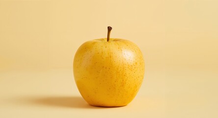 Golden Delicious Apple Isolated on a Matching Yellow Background for Culinary Purposes.