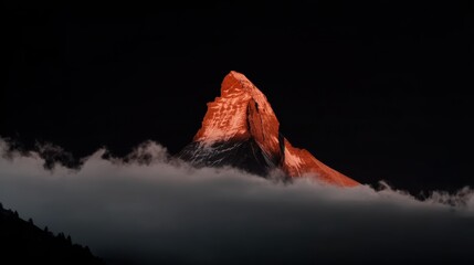 Sunrise illuminating snowy mountain summit, perfect for travel blogs or nature art.